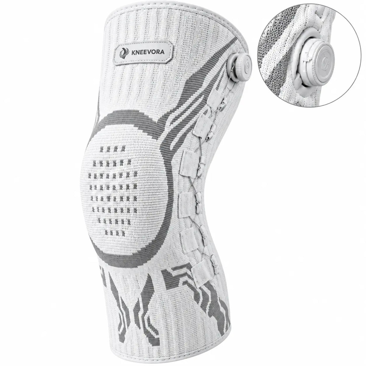 A white and gray Kneevora knee support brace with an adjustable dial closure, shown on a white background with a circular inset detail of the dial mechanism.